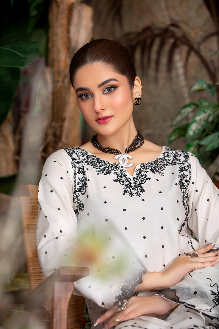 White and silver Pakistani suit with fine embroidery. Vavaa UK outlet collection near me.