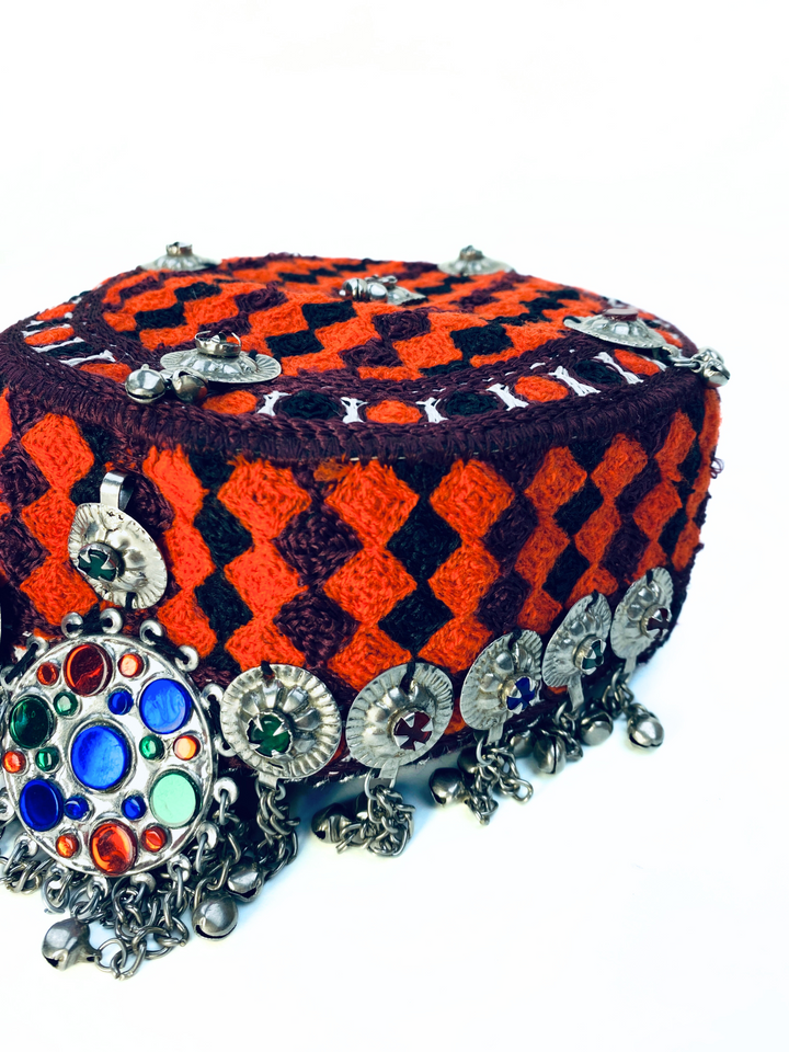 Embroidered Afghan cap with brooch and antique coins cultural fashion UK