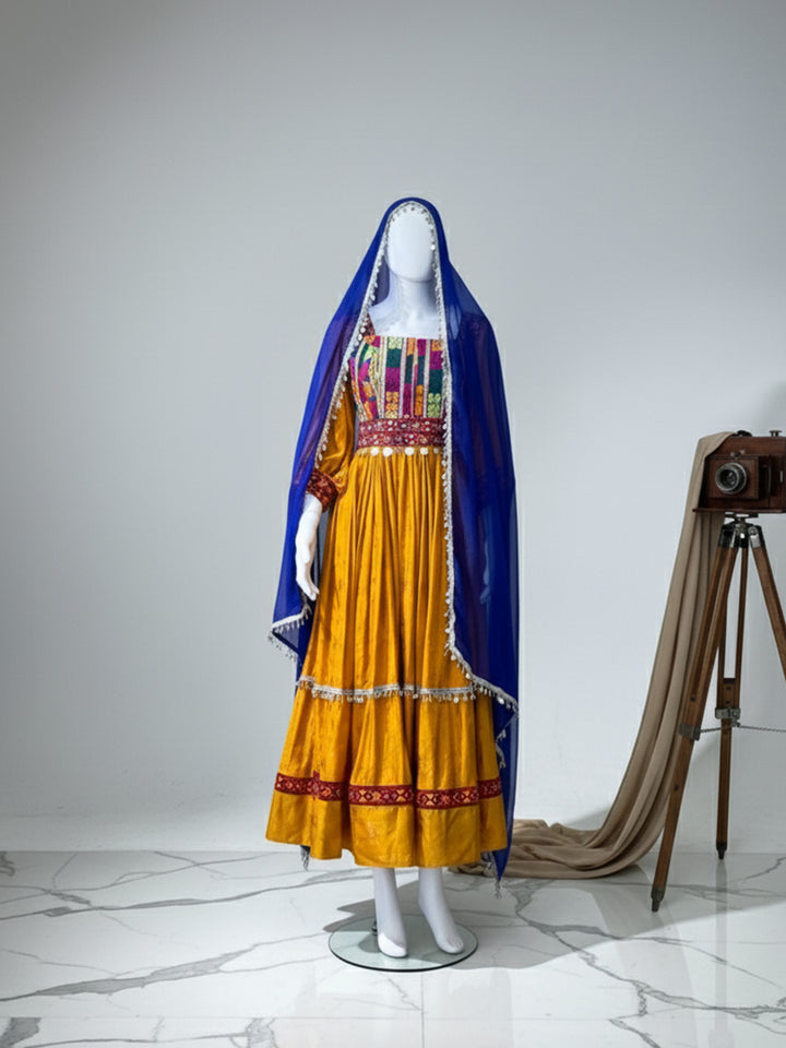 Find Afghan Kuchi dress with orange & blue embroidery on sale in London. Affordable price, discounted rates, and fast shipping.