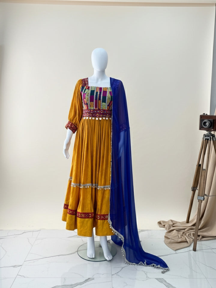Shop Afghan Kuchi dress with embroidered orange & blue design at Vavaa. Affordable prices and exclusive sale offers with fast shipping.