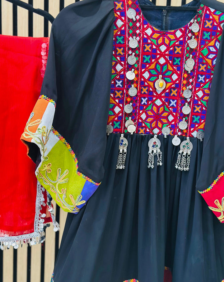 Afghani handmade black dress with colourful embroidery and traditional design motifs

