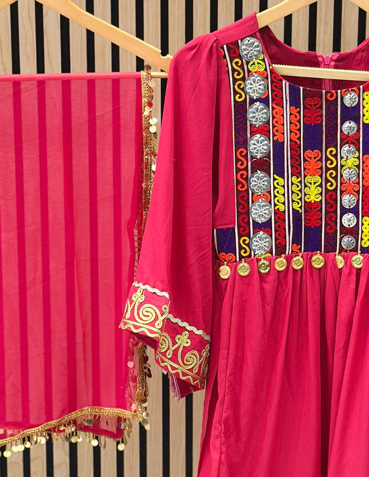 Afghani cultural dress for girls in pink with tribal patterns and decorative