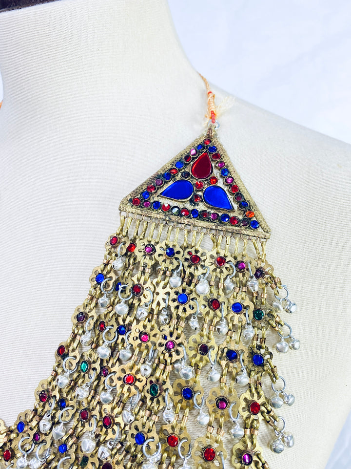 Decorative necklace with colorful gemstones on a mannequin