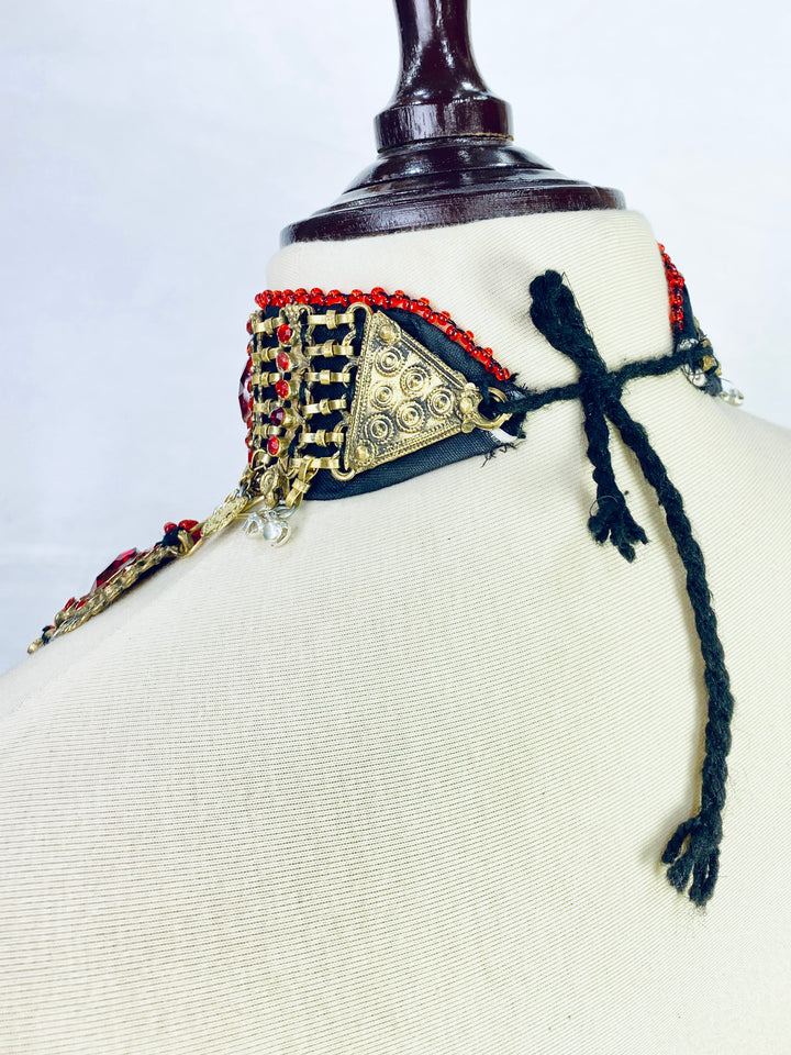 Decorative headband with intricate designs on a mannequin head.
