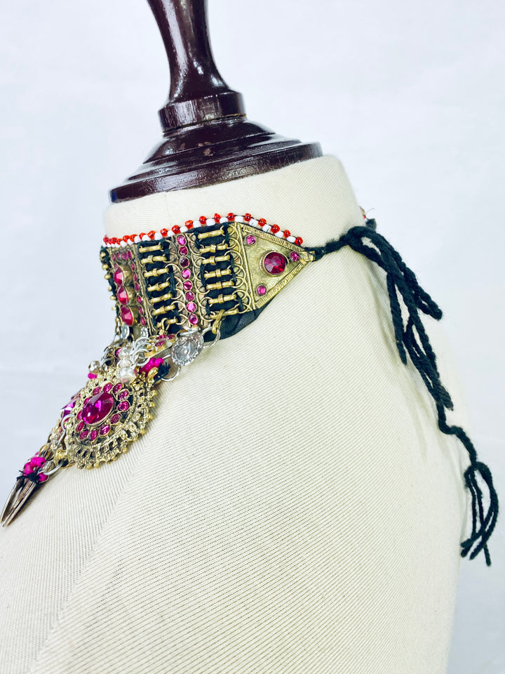 Decorative headband with gemstones on a mannequin against a white background