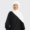 Woman wearing black umbrella abaya with white headscarf by Vavaa near me
