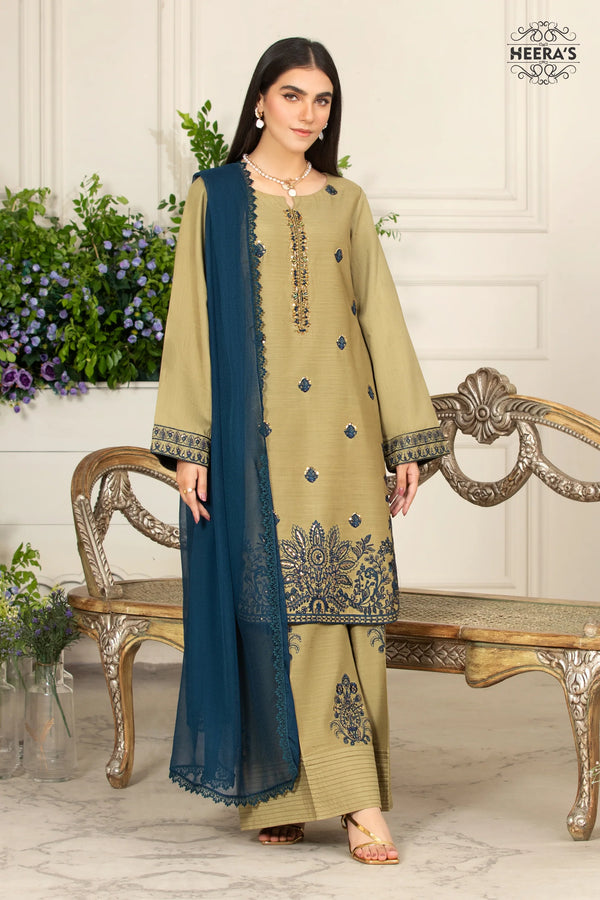 Woman wearing a beige and blue embroidered 3-piece Raw Silk dress with matching dupatta available near me