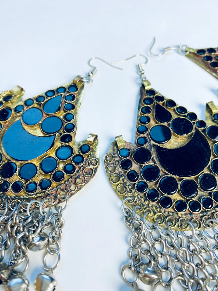 Ornate earrings with blue stones and gold accents on a white background, elegant handmade jewellery available at Vavaa UK store near you, close by, local shop in the UK, perfect for weddings, parties, and cultural events.