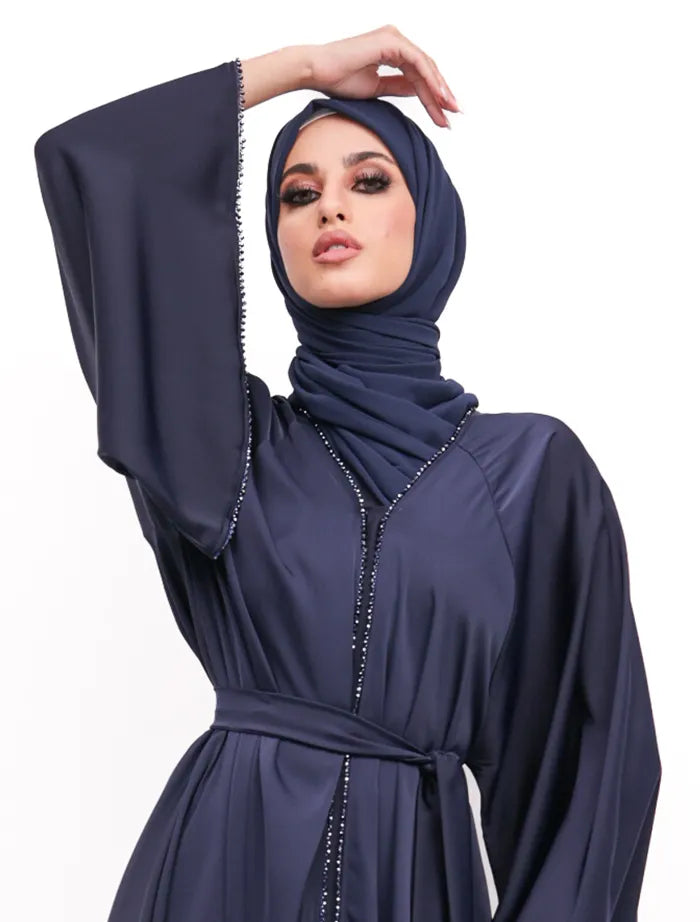Chic Makeba Pearl Abaya in uk near me with satin finish, black accents, and flattering umbrella silhouette. Find stylish abayas in the UK