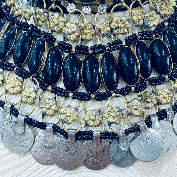 Premium necklace with blue beads, gold floral elements, and silver coins, trendy ethnic jewelry available at Vavaa outlet near me in UK and you can shop online.
