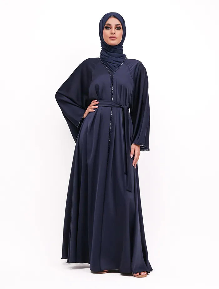 Elegant Makeba Pearl Abaya in satin with modern black accents and adjustable belt, perfect for weddings and special events in the UK.