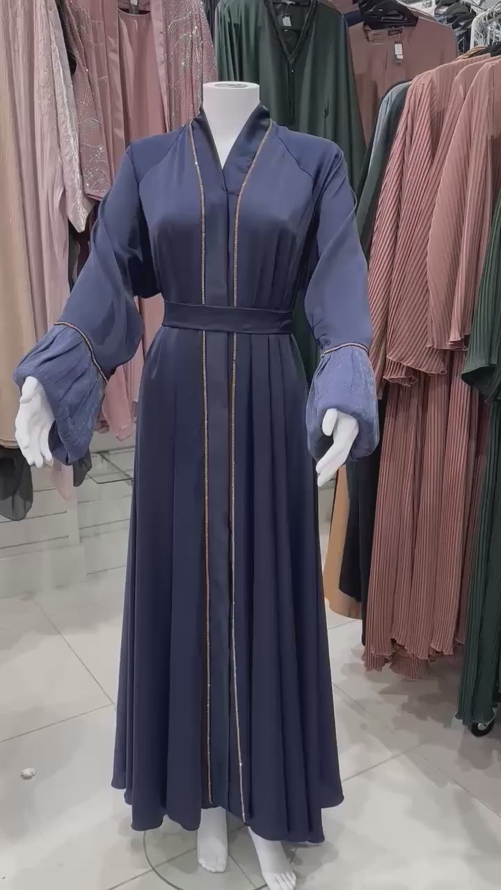 Navy blue satin abaya with gold accents and stylish organza cuffs, ideal for events. Find abayas near you in the UK