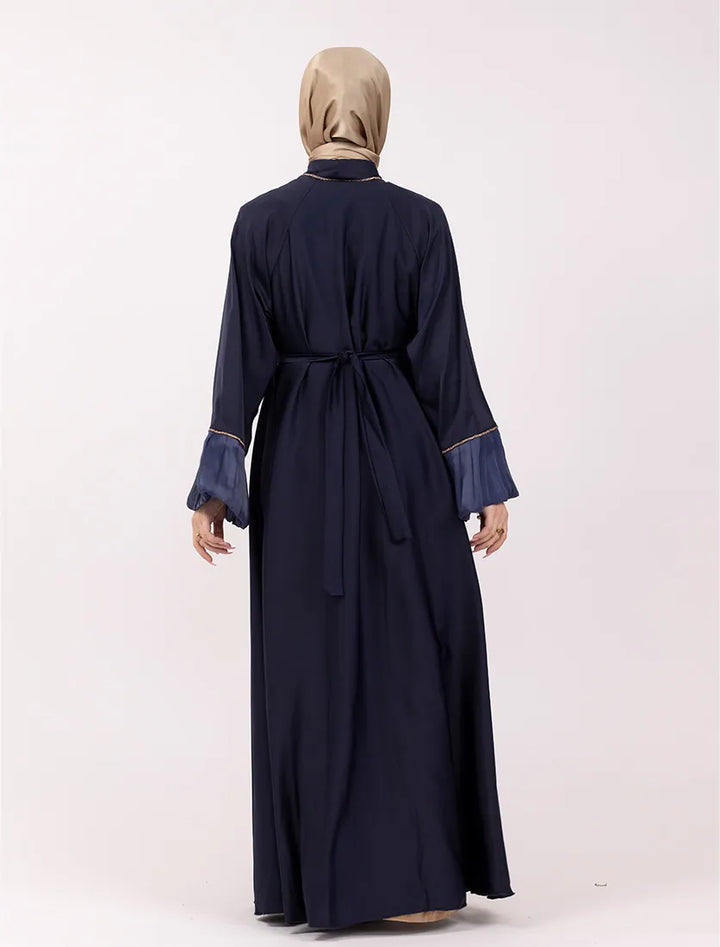 Elegant satin navy blue abaya near me with gold trim and organza puffed sleeves. Explore Vavaa Outlet for more