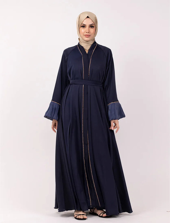 Modest navy blue open-front abaya with organza cuffs and gold detailing. Shop abayas near me online in the UK