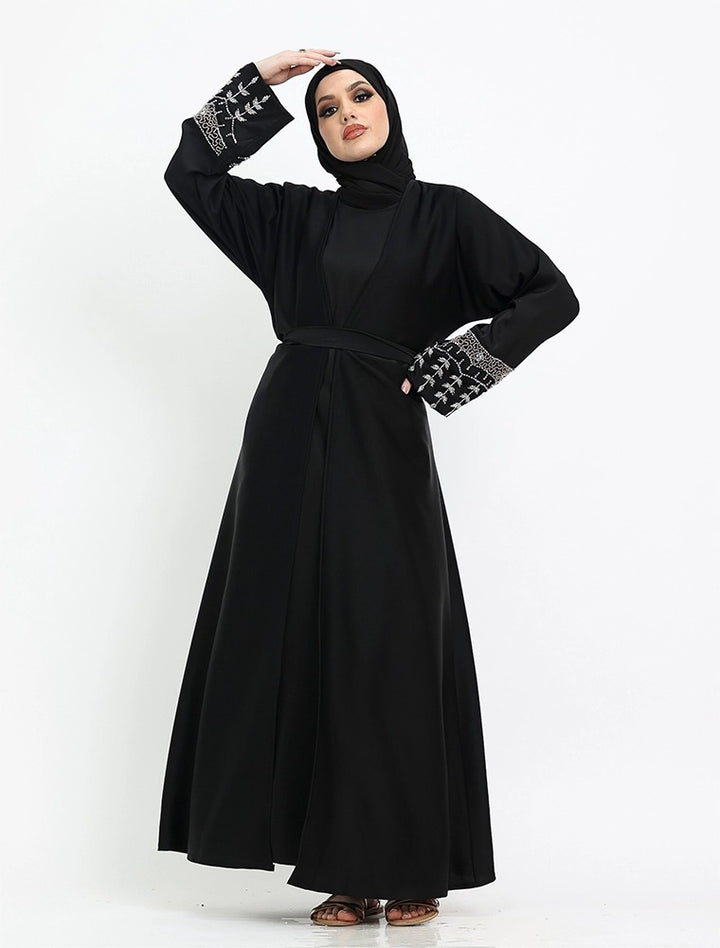 Chic black abaya near me with modern cut and beaded cuffs now at Vavaa London abaya boutique.