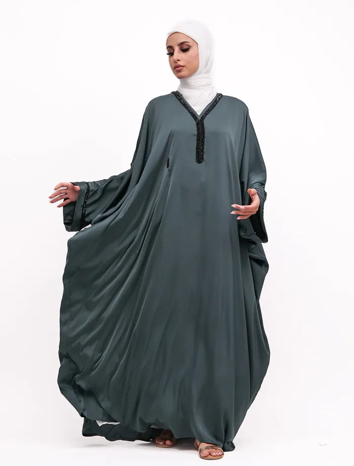 Elegant black batwing abaya with hand beaded cuffs, available at abaya store near me.