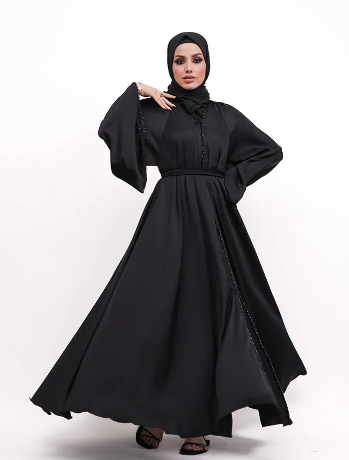 Elegant Makeba Pearl Abaya near me with satin fabric, black diamond-cut trim, and adjustable belt. Available for sale in the United Kingdom.