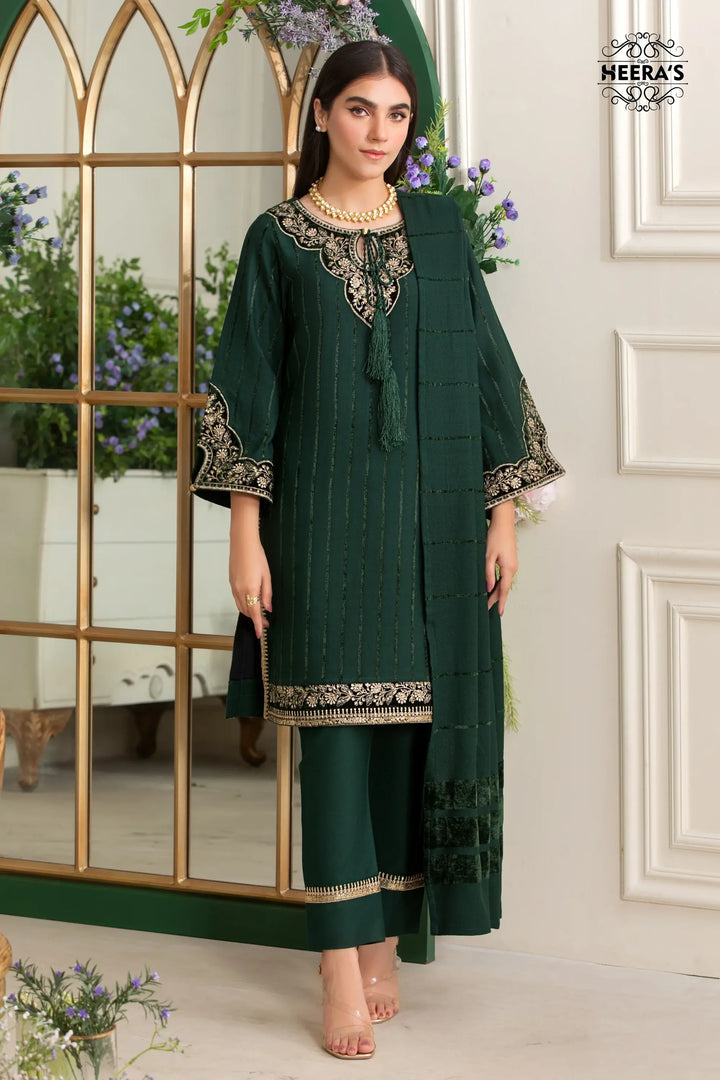 Woman wearing a green linen and velvet dress near me with embroidery and velvet patches, paired with a matching velvet lined shawl available near me