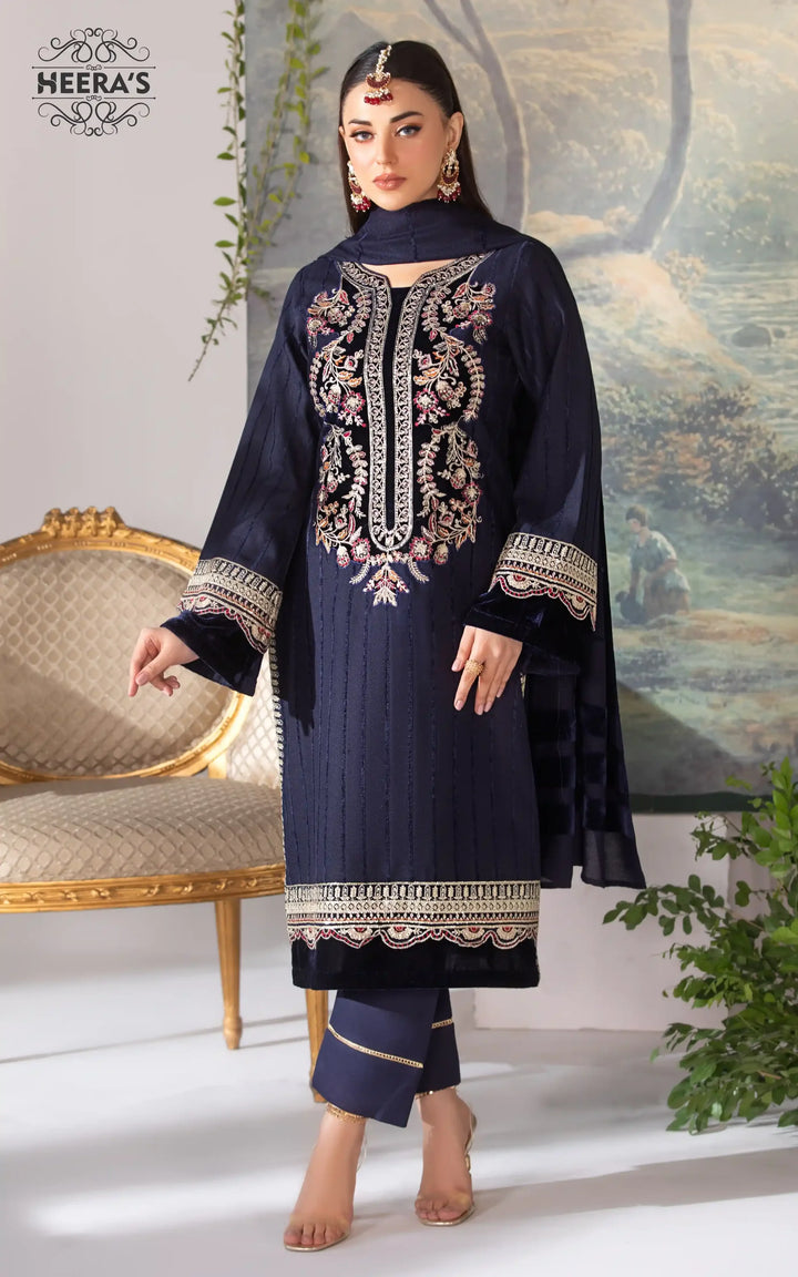 Woman wearing a navy blue Pashmina Velvet Kameez Shalwar near me with embroidery and matching dupatta available near me at Vavaa outlet in UK.
