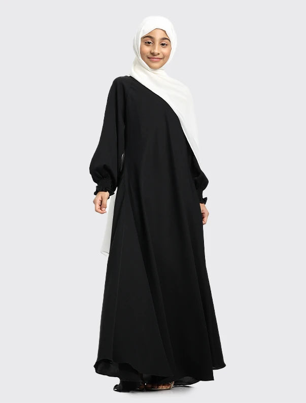 Vavaa women’s black umbrella abaya paired with white headscarf near me
